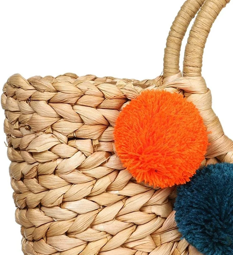 Sac tissé style rotin à pompons