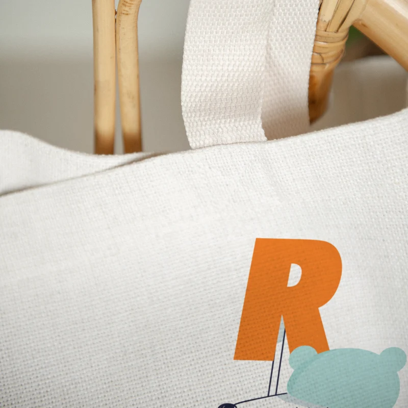 Tote bag Anse en toile Des chiens et des lettres oranges
